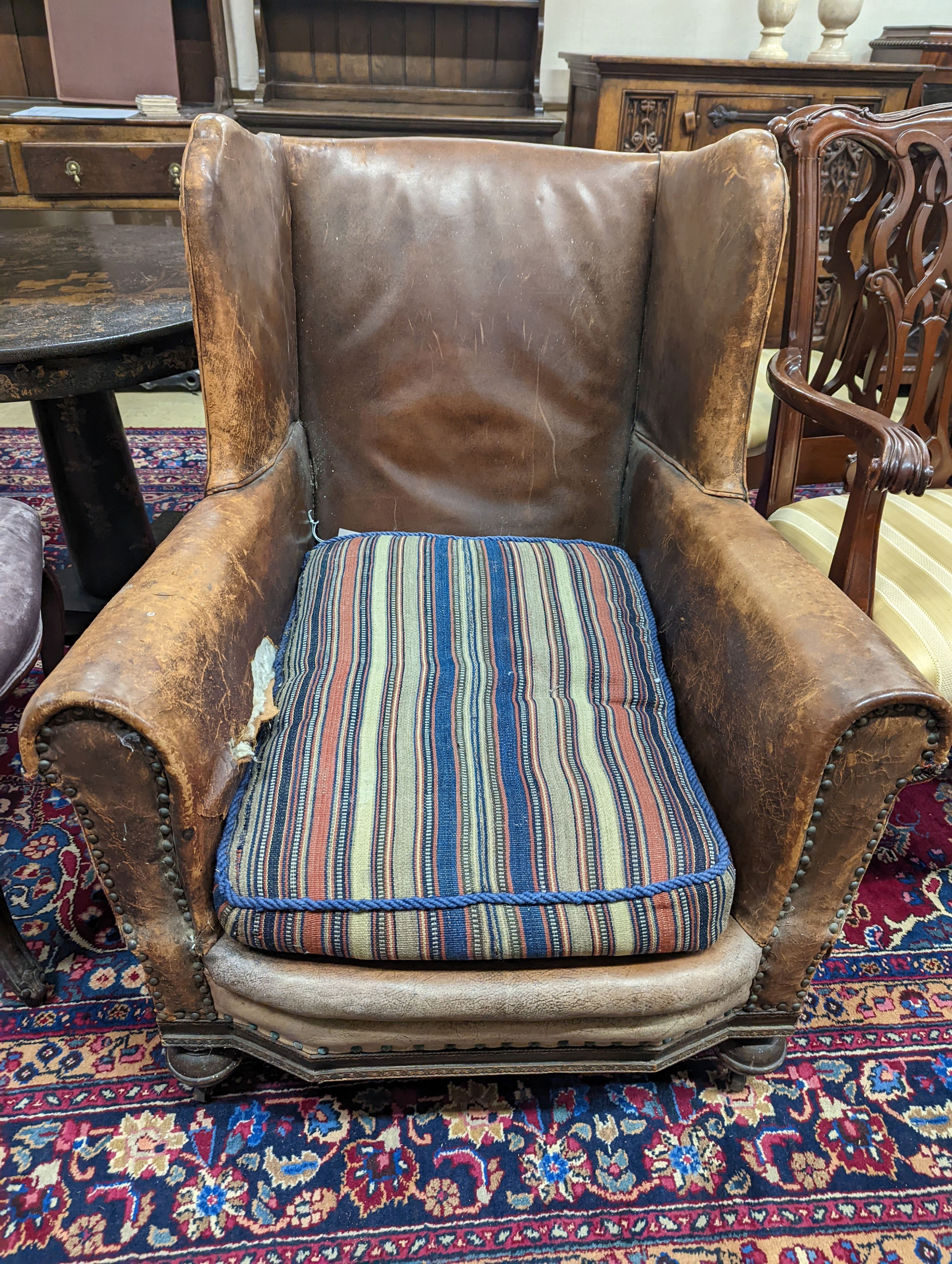 A 1940s French leather club armchair. H-91cm.